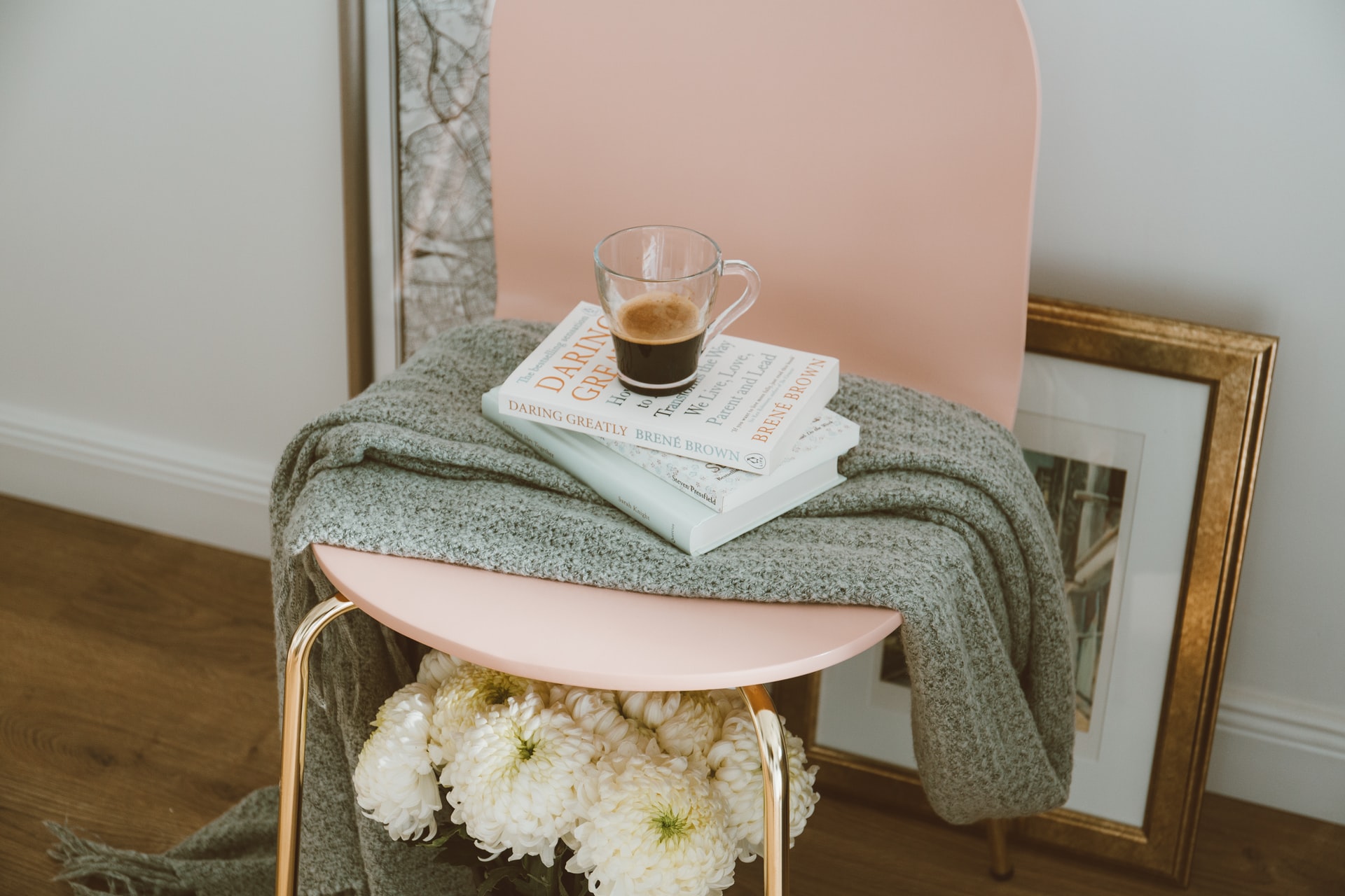 books and coffee on a chair